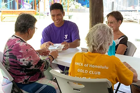 young adult socializing with senior citizens